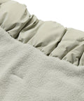 Close-up of the fleece lining and snap closures on a dachshund puffer jacket