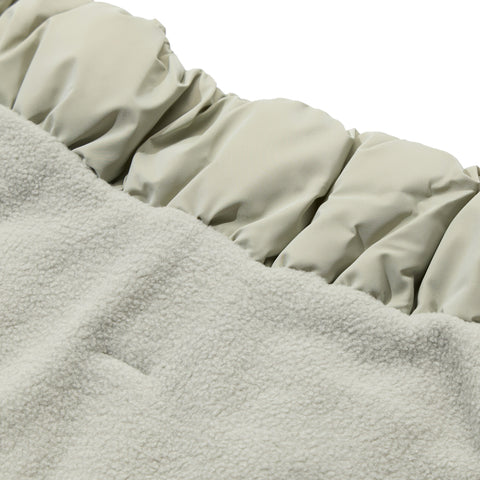 Close-up of the fleece lining and snap closures on a dachshund puffer jacket